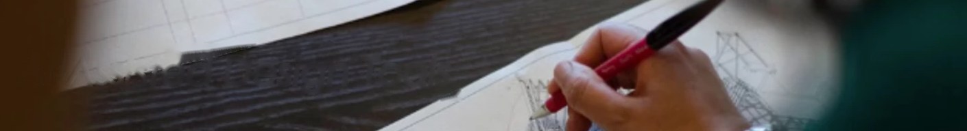 A hand sketching a structure on a technical drawing